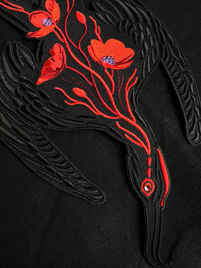 frigate bird patch with red florals 
