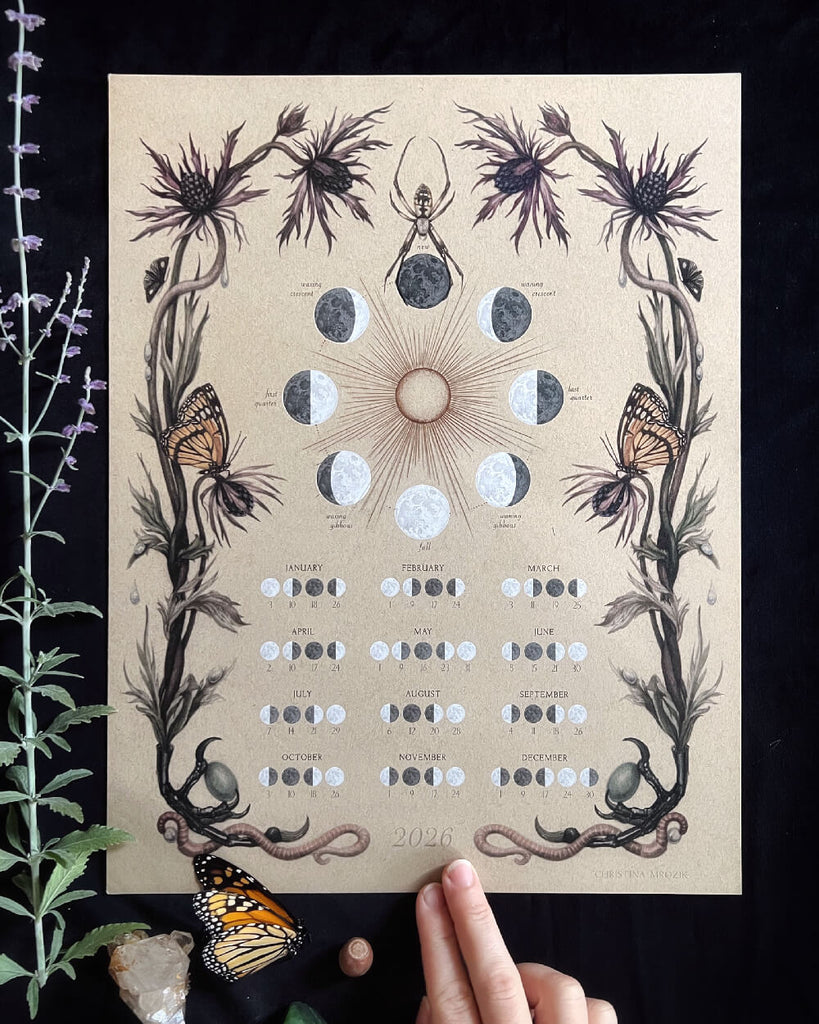 Decorative calendar with nature-themed illustrations on a dark background