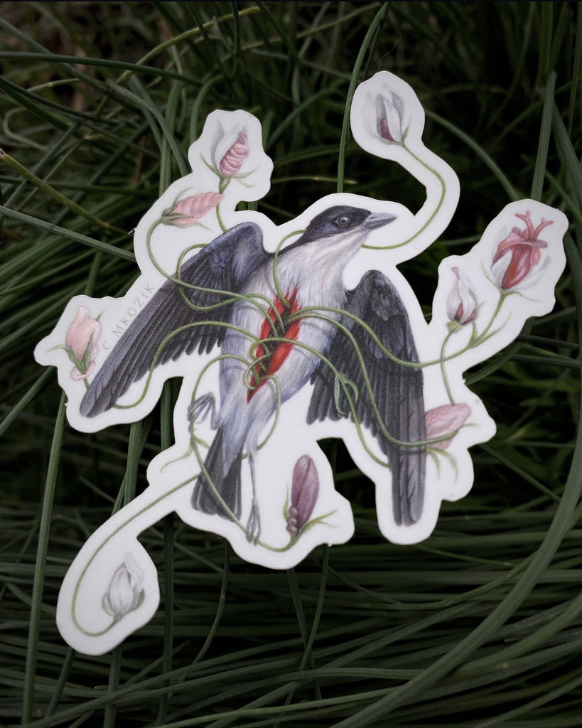 A small sticker of a gray flowerpecker with pink flowers growing from its chest.