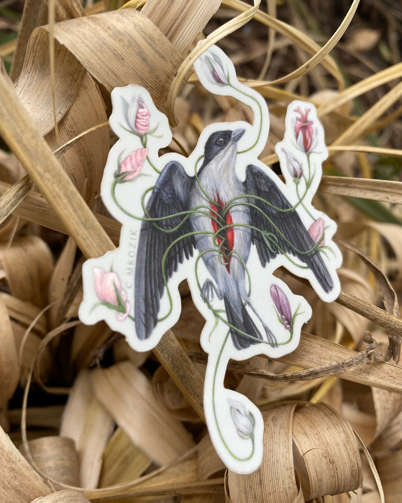 A small sticker of a gray flowerpecker with pink flowers growing from its chest.