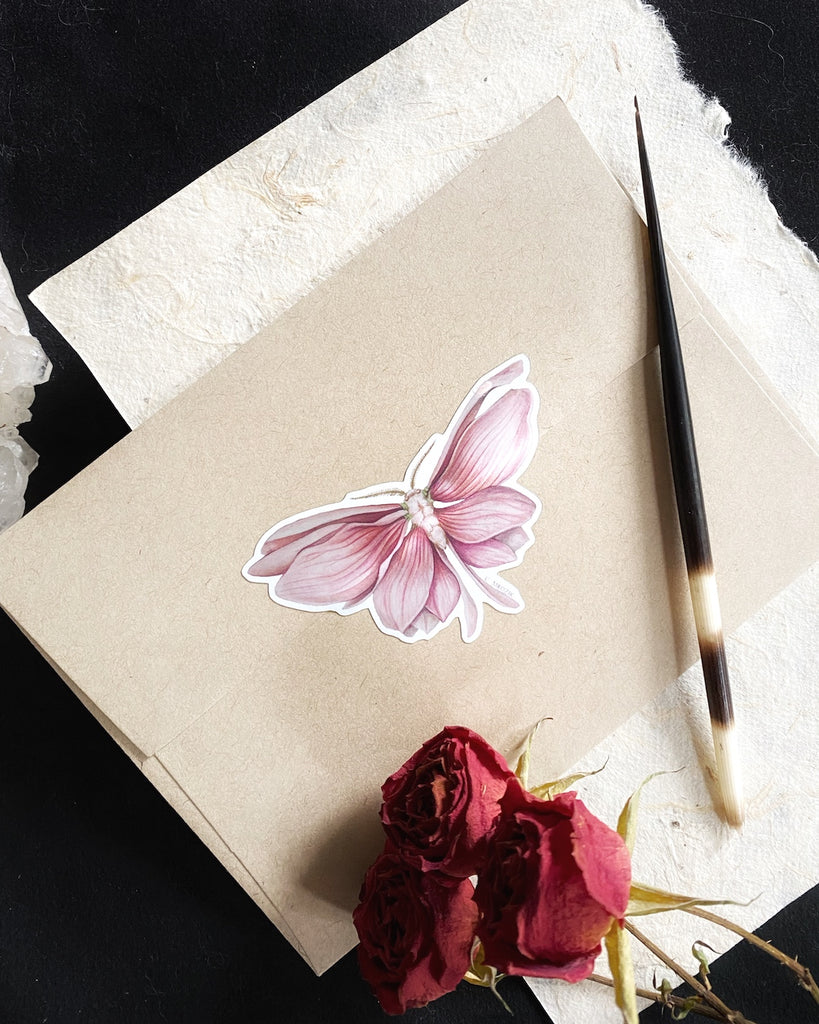 Small sticker of a moth with shimmering pink magnolia petals for wings.