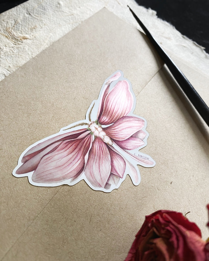 Small sticker of a moth with shimmering pink magnolia petals for wings.