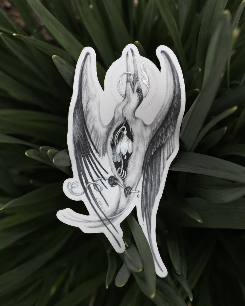 Small matte sticker with a graphite drawing of a white tern with a holographic snowdrop flower in its chest.