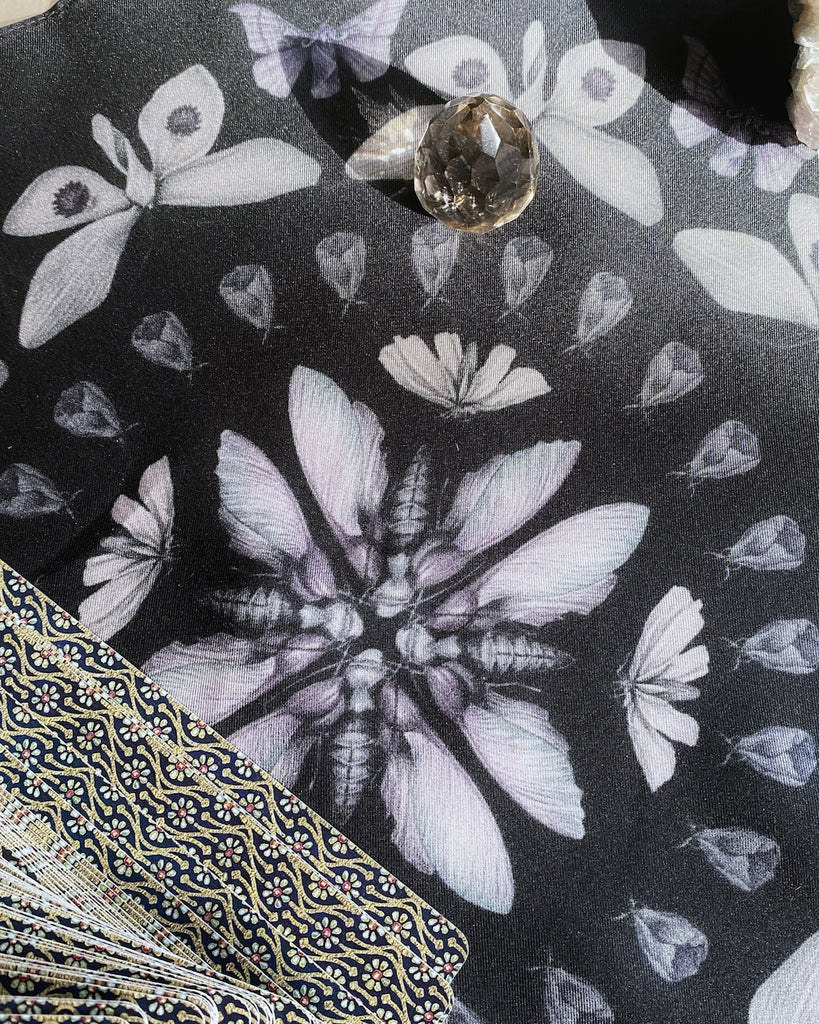 Black silk handkerchief with a circular pattern of purple moths.