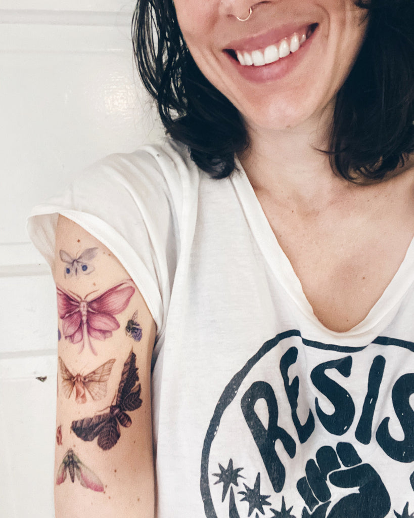 A temporary tattoo sheet of colorful butterflies and moths with flower petals for wings.