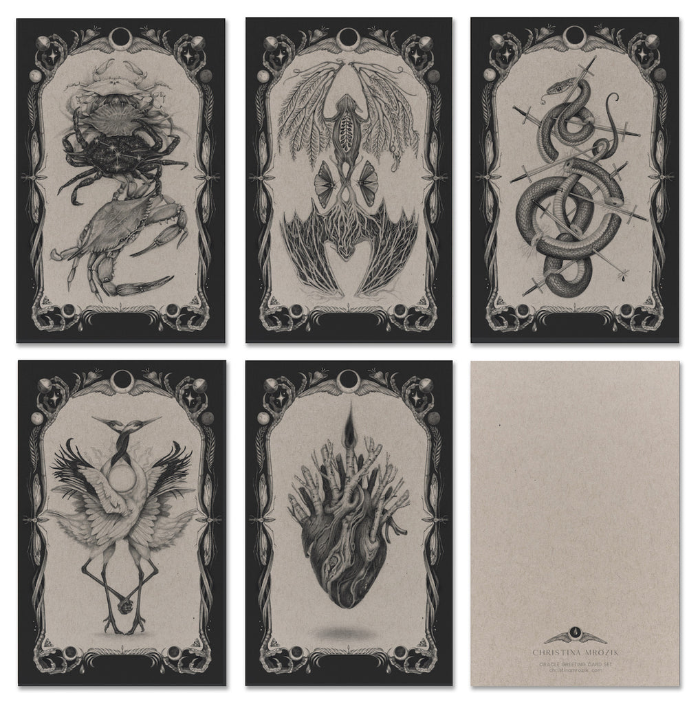 Set of five black and white greeting cards with tarot style illustrations of bats, herons, crabs, hearts, and snakes.